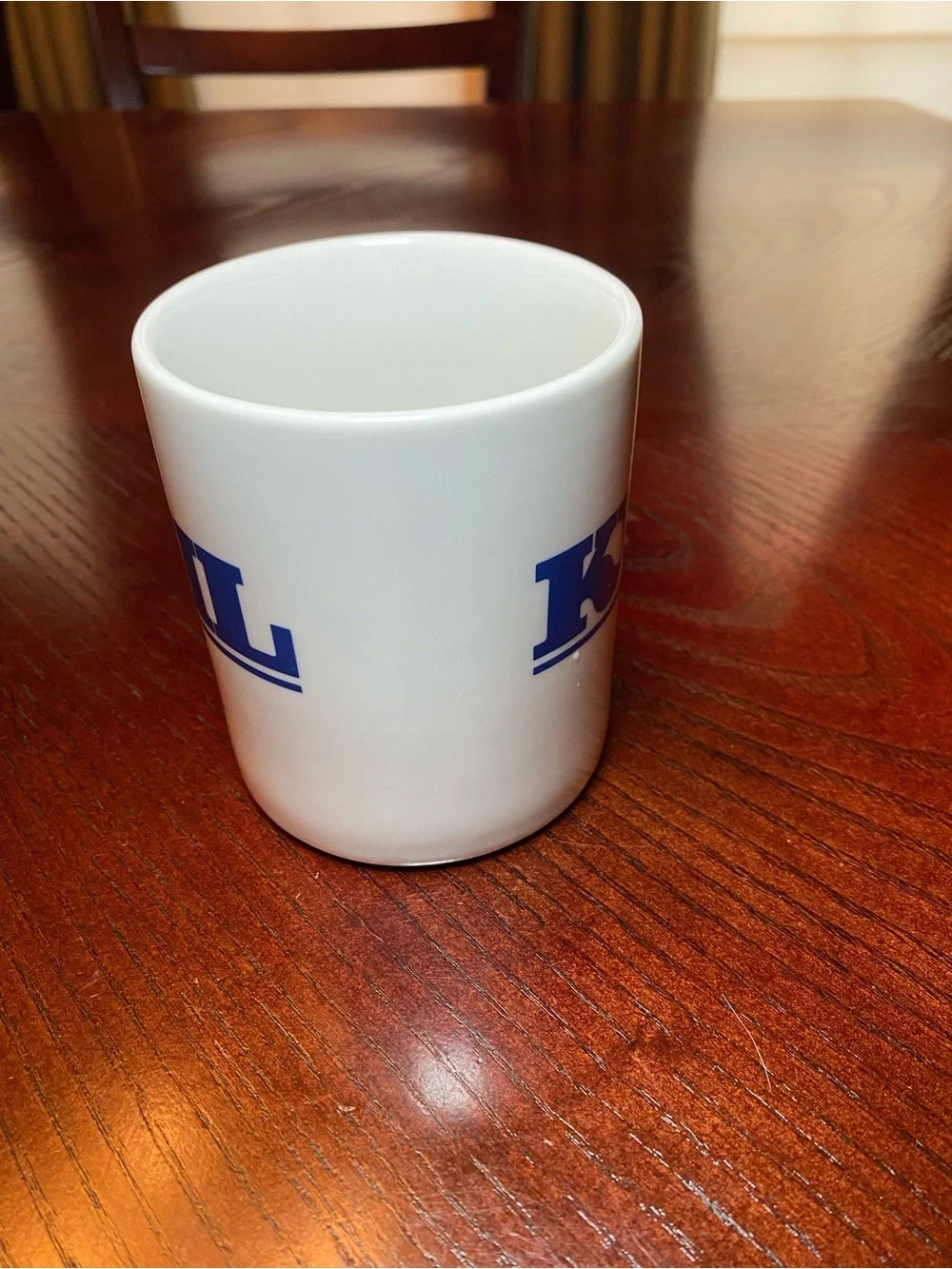 White Ceramic Coffee Mug with Blue KVIL Radio Logo. 10 Oz
